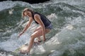 MUNICH - AUGUST 08: An unidentified female surfer works the wave at the Surf & Style August 08, 2015 in Munich